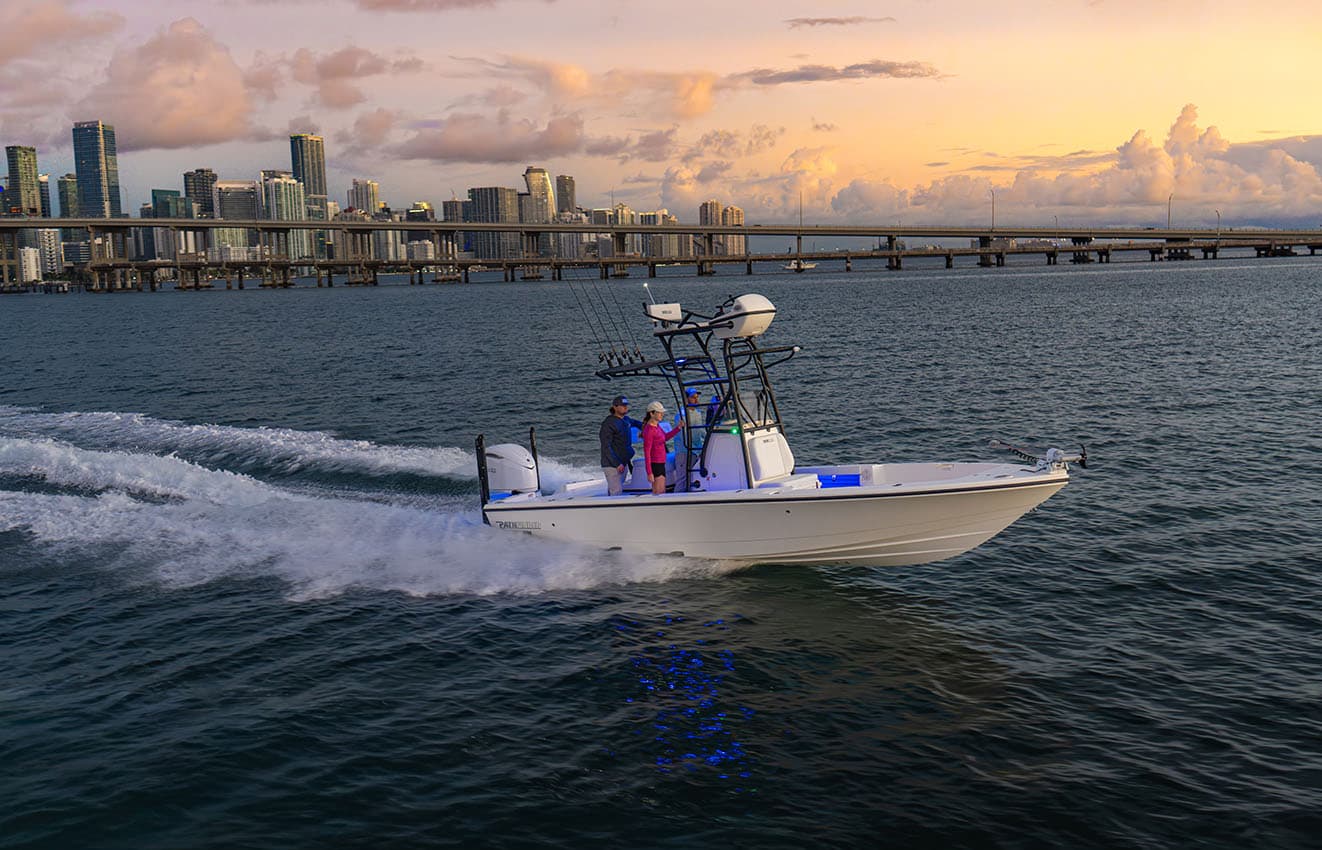 Pathfinder 26 Foot Bay Boat Cruising by a City.