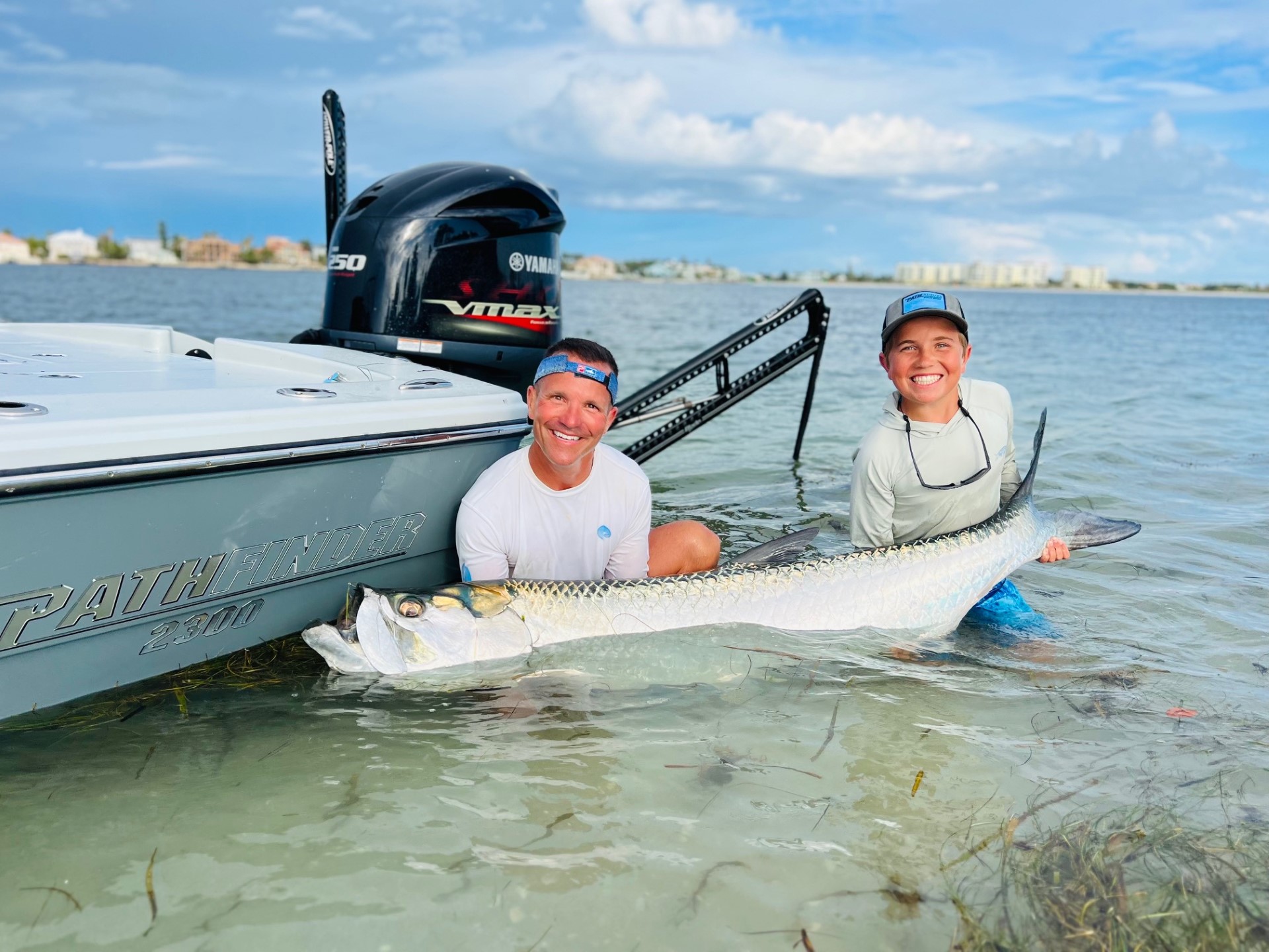 A couple taking a selfie on their pathfinder boat.